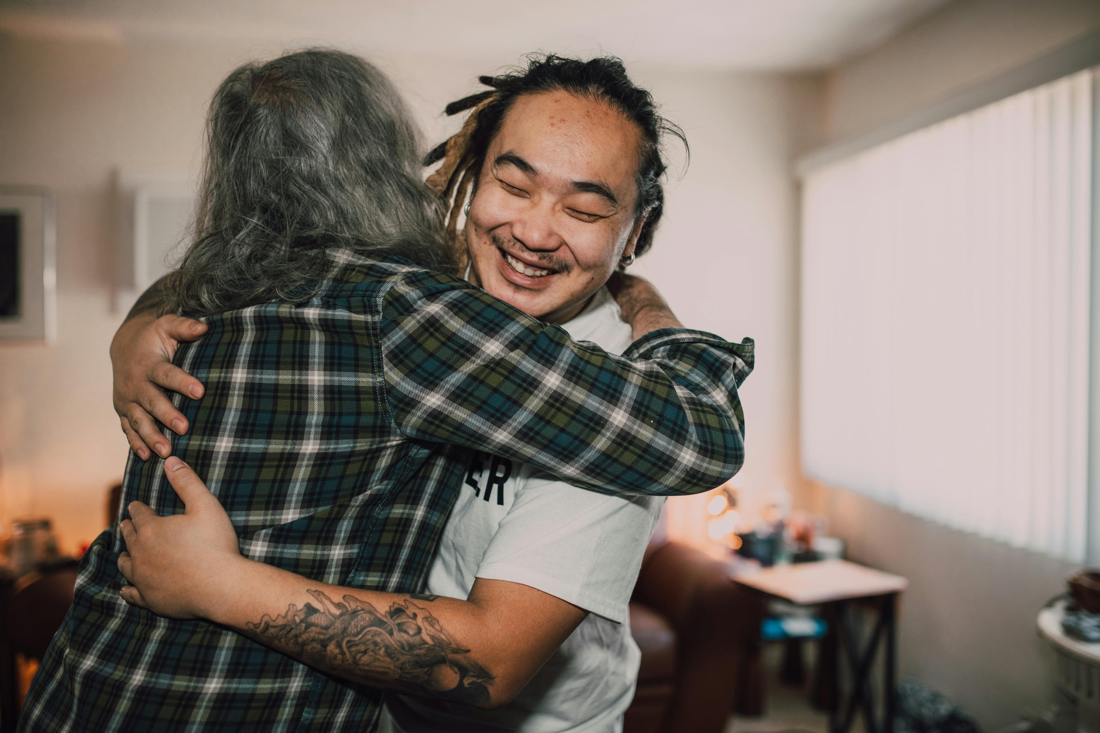 A volunteer hugging another person.